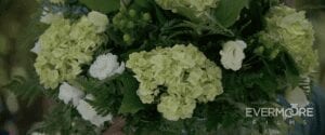 The tall lime-filled vases exploded with beauty from every beautiful kind of white and green flower! | www.EvermooreFilms.com