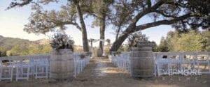 A perfectly romantic and perfectly rustic wedding ceremony under the oaks at Spanish Oaks Ranch | www.EvermooreFilms.com/weddings