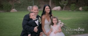 Bride and groom with their ring bearer and flower girl - what a sweet family they make! | www.EvermooreFilms.com